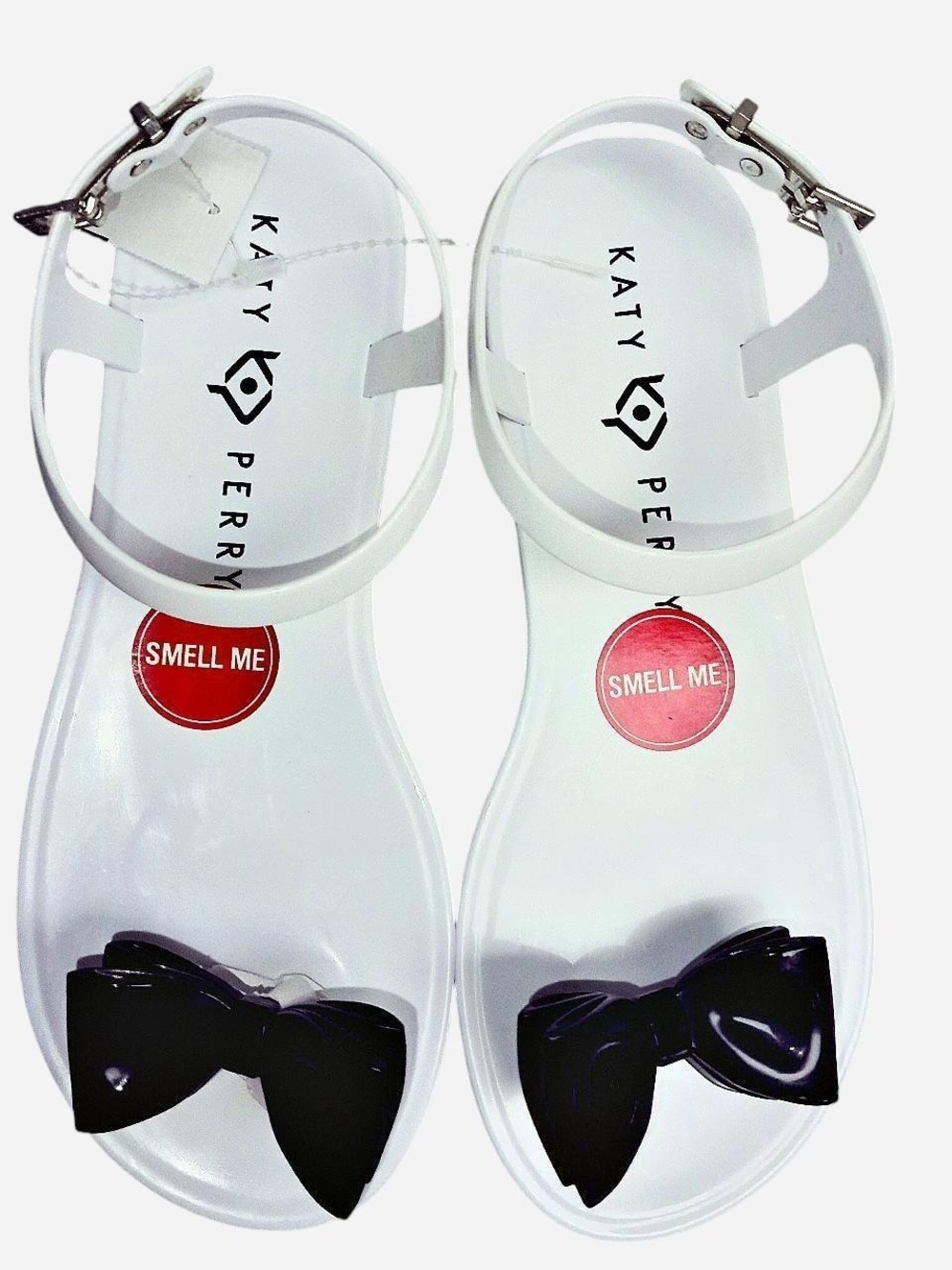 Katy Perry Collections White Jelly Sandals with Black Bow Accent